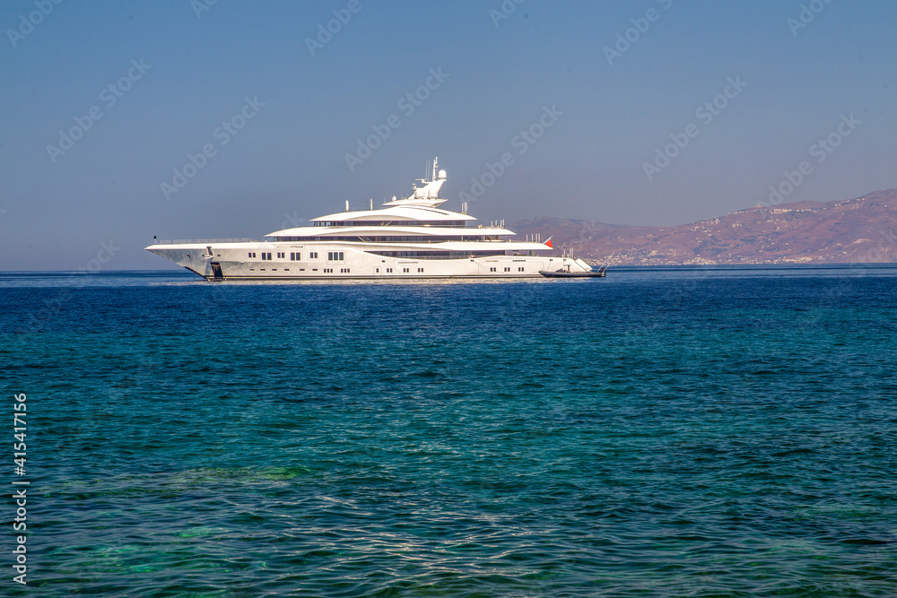 Luxury yacht next to downtown of   famous Mykonos town  (Mykonos island)