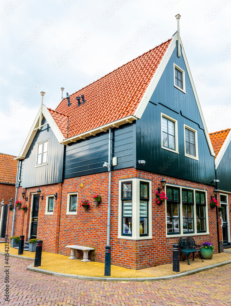 VOLENDAM, NETHERLANDS. Typical Dutch village houses in Volendam. Beautiful village houses facade.