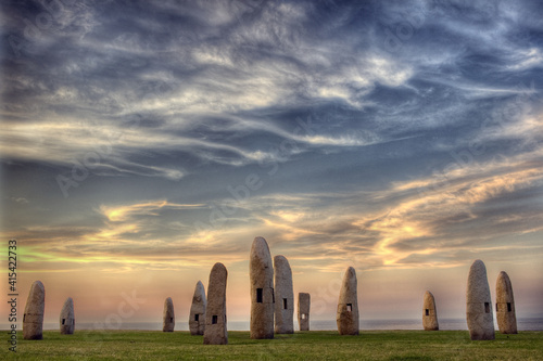 menhirs hercules tower ,stonehenge at sunset