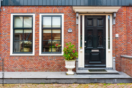 VOLENDAM  NETHERLANDS. Typical Dutch village houses in Volendam. Beautiful village houses facade..