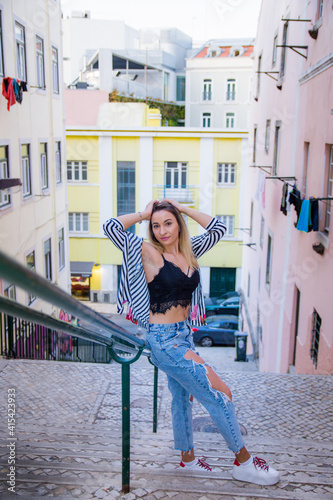 extremely beautiful girl in a summer top walking around the city. summer walks in warm Lisbon in Europe © Nazar