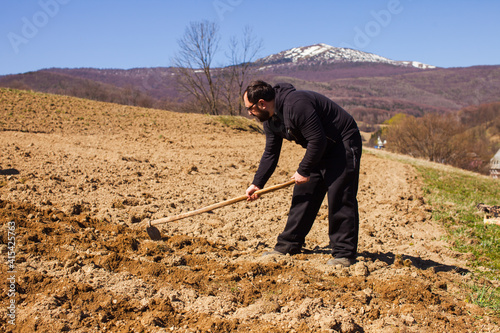 Working on a soil at mountaing village photo