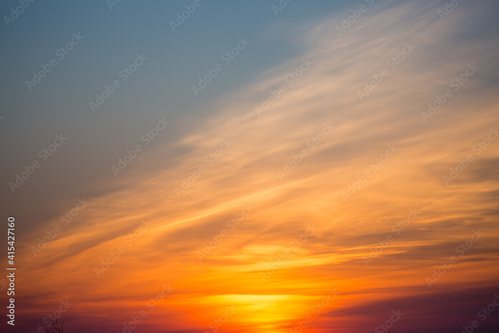 Colorful sunset sky and clouds with dramatic light and copy space