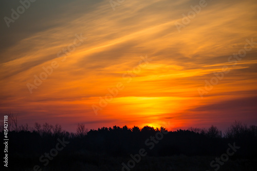 Colorful sunset sky and clouds with dramatic light and copy space © mtatman