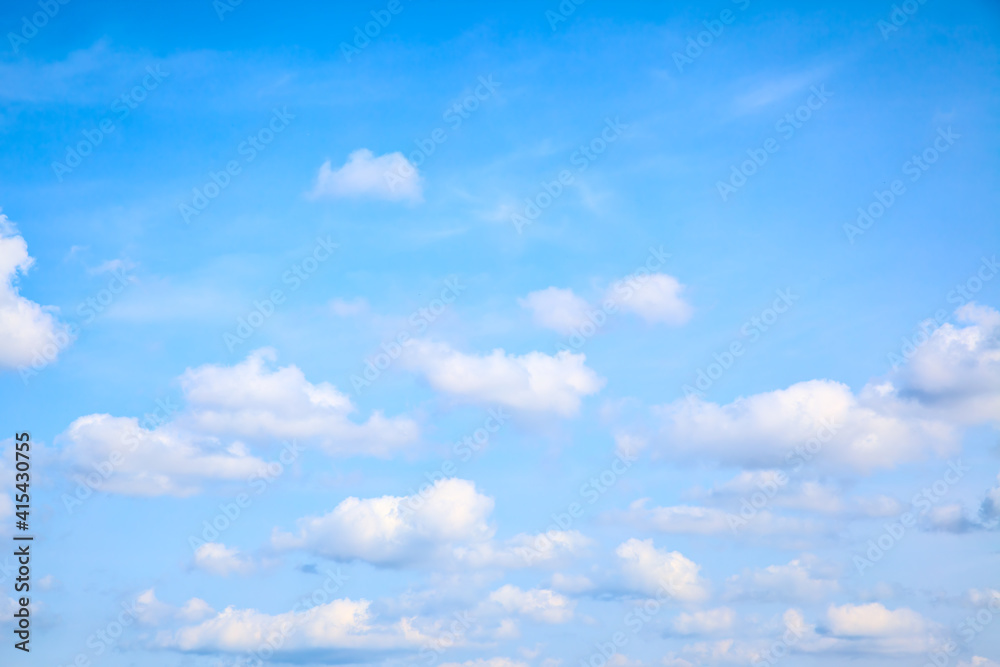 Light blue summer sky with small heap clouds