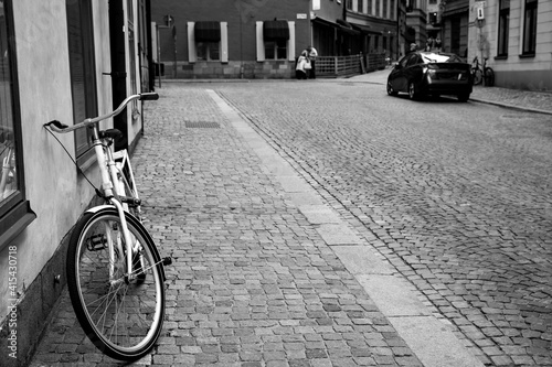 Street and bicycle by the wall in the Old Town of Stockholm