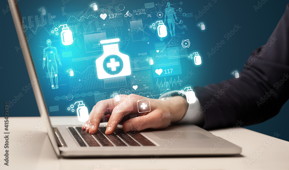 hand browsing on the internet for medical issues with medication icons coming out from the screen hand browsing on the internet for medical issues with medication icons coming out from the screen