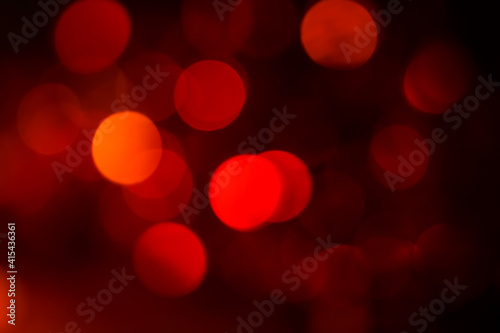 Bokeh abstract texture colorful red defocused background Dimmed light. 