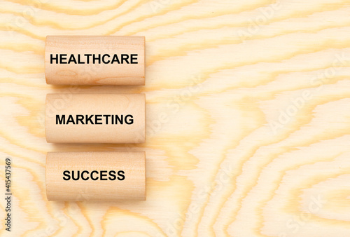 three pillars marked with healthcare, marketing and success