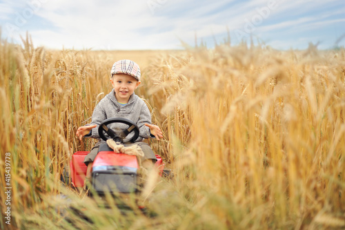 8, agricultural, agriculture, boy, caucasian, child, childhood, cornfields, countryside, cute, drive, farm, farmer, farming, field, freedom, happy, harvest, kid, little, machinery, male, meadow, natur