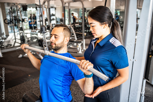 Physiotherapist working with client on rehabilitation exercises
