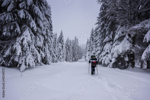 man walking in snow