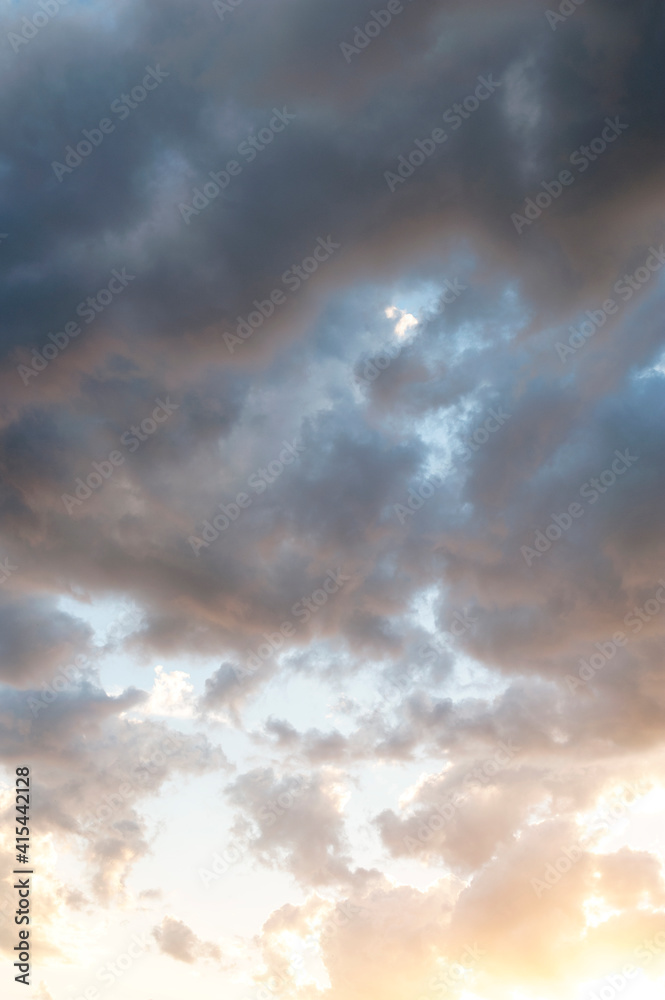Stratocumulus of clouds at sunset. Sky.