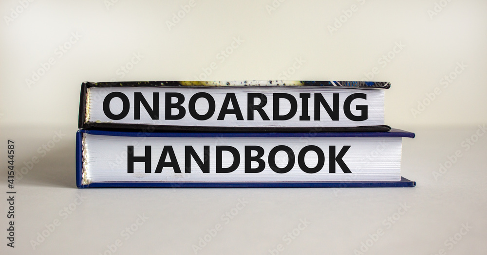 Onboarding handbook symbol. Books with words 'onboarding handbook' on beautiful white background. Business and onboarding handbook concept. Copy space.