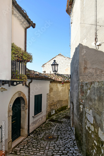 An alley between the old stone houses of Sassinoro, a medieval village in the province of Benevento. photo