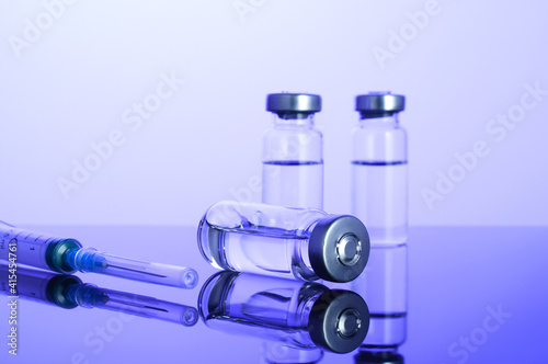 Coronavirus vaccine,vial,dose,  flu shot drug, needle syringe, vaccination hypodermic injection, treatment disease