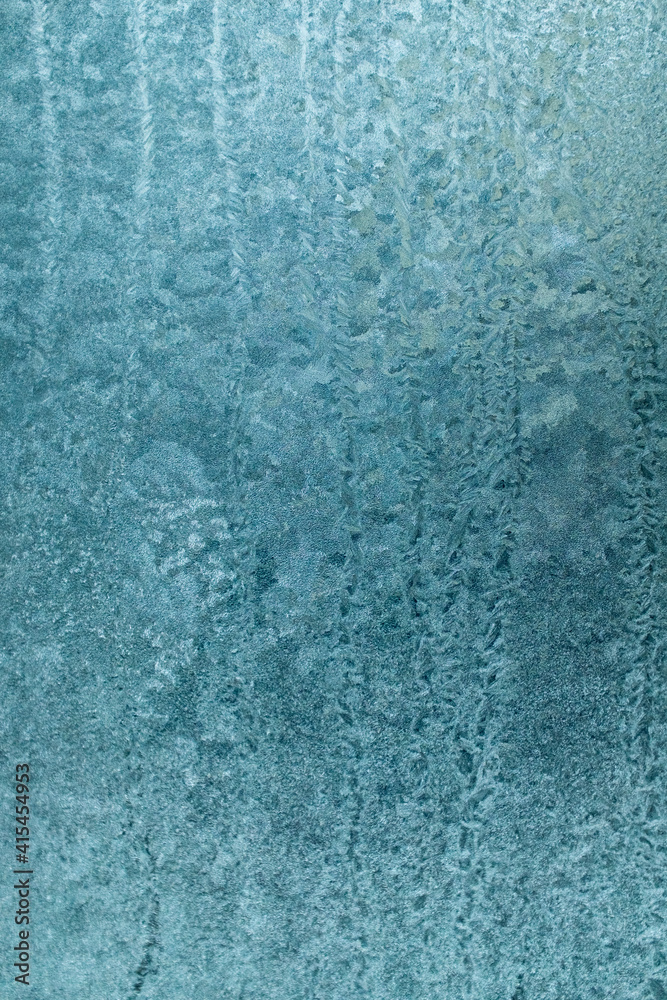 Ice crystals on glass in winter