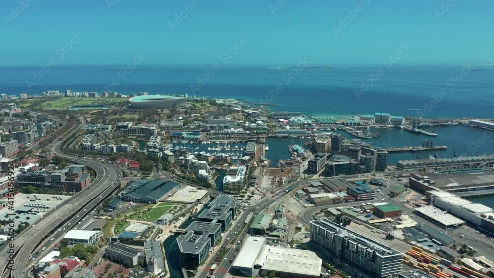 Scenic aerial wide drone shot above central Cape Town, South Africa with scenic view of harbor and downtown business area. Panoramic view of Bo-Kaap, Zonnebloem, Oranjezicht and Table Mountain. Scenic aerial wide drone shot above central Cape Town, South Africa with scenic view of harbor and downtown business area. Panoramic view of Bo-Kaap, Zonnebloem, Oranjezicht and Table Mountain.