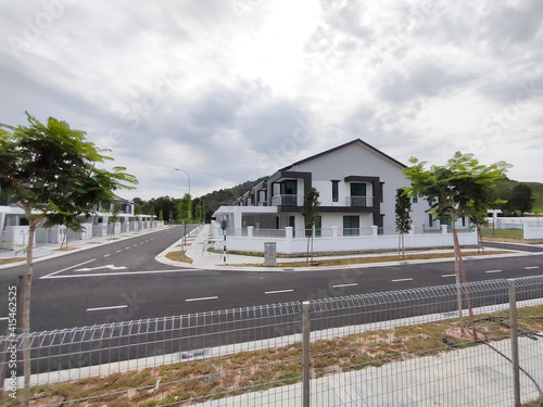 SEREMBAN, MALAYSIA -APRIL 15, 2020: New double story luxury terrace house under construction in Malaysia.  Designed by an architect with a modern and contemporary style. photo