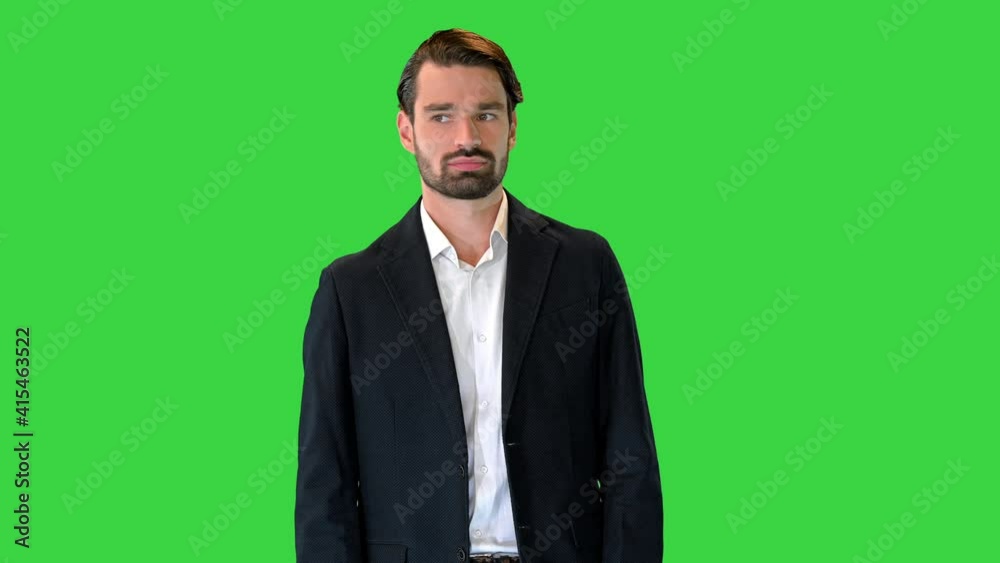 Fashionable businessman in a suit walking slowly on a Green Screen, Chroma Key. Fashionable businessman in a suit walking slowly on a Green Screen, Chroma Key.