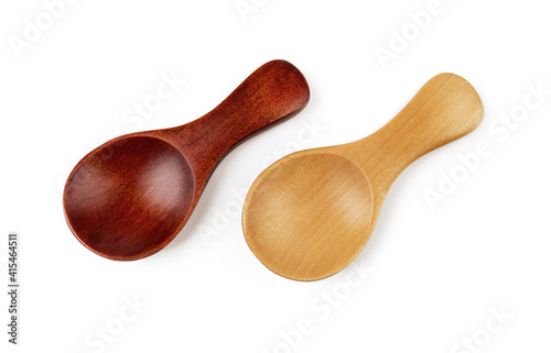 Pair of small wooden spoons for tea or shugar isolated on white background. Dark and light empty spoons for food design. Beautiful eco-friendly tableware made of natural wood. Living green lifestyle.