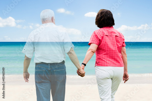 Senior Couple Walking At Beach © Andrey Popov
