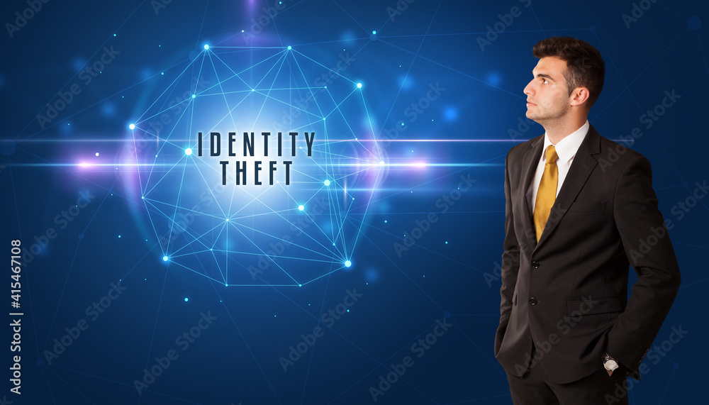 Businessman thinking about security solutions with IDENTITY THEFT inscription Businessman thinking about security solutions with IDENTITY THEFT inscription