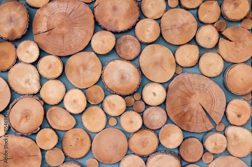 Wooden background. Round bars of wood. A wall of bars