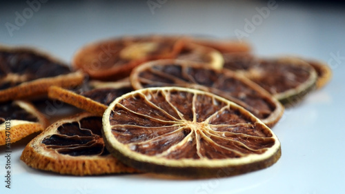Natural background of round dry slices of red grapefruit or lemon