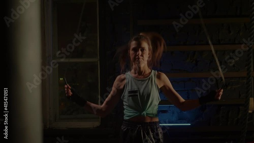 Young girl doing sports in the gym. Atmospheric gym