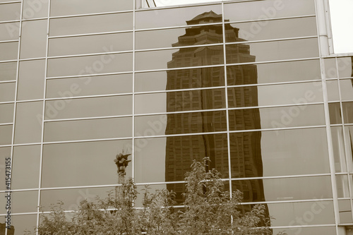 Skyscraper reflected in window photo