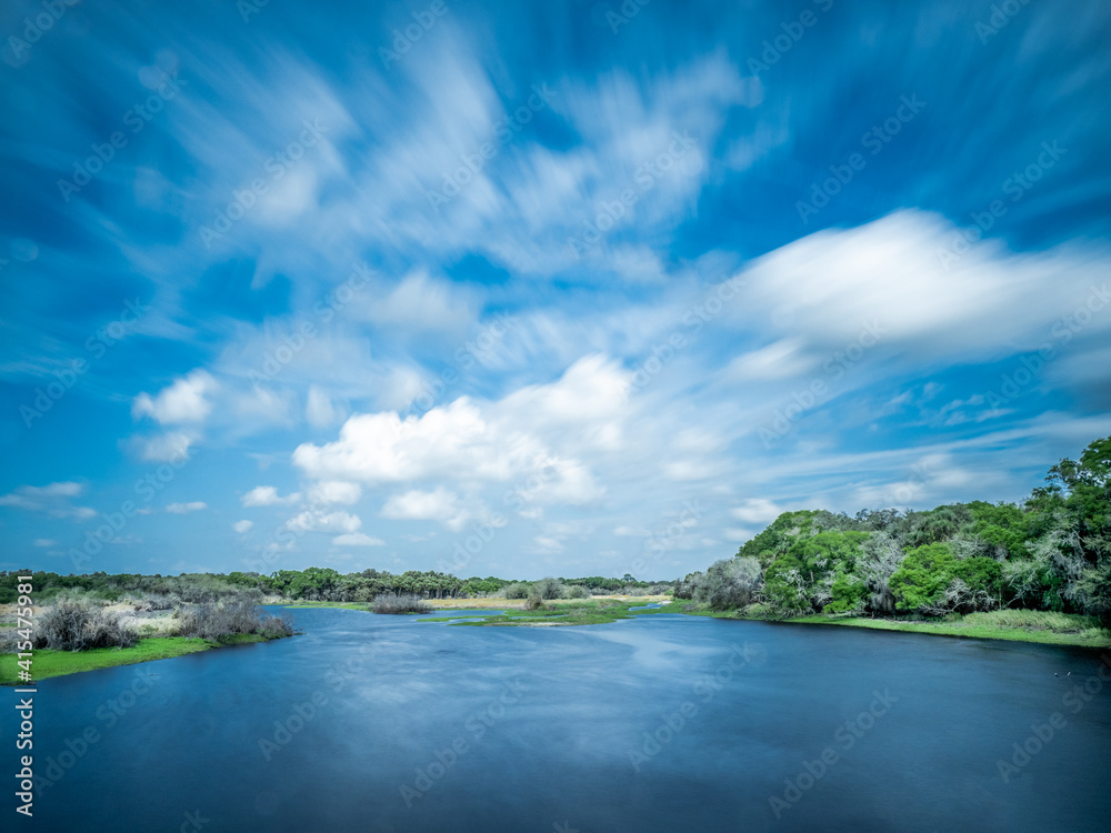 Sunny day with white clouds over Myakka River in Myakka River State Park in Sarasota Florida USA