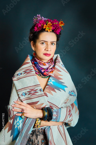 The woman is dressed as Frida Kahlo photo