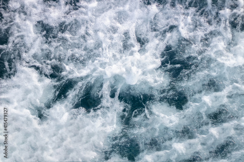 Ocean surface background with waves and foam.