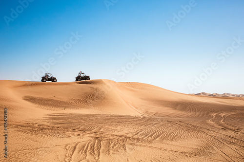 Quad buggy vehicles race at Al awir desert near Dubai, UAE, extreme sports transport, driving off-road photo