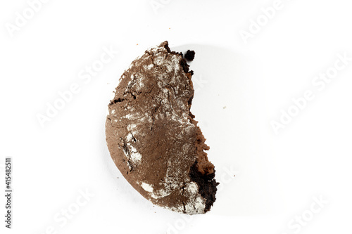 a half piece of cookie stuffed with melted chocolate, homemade top view 
