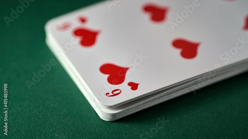 One card is removed from a 52-card deck. Shallow depth of field. 
