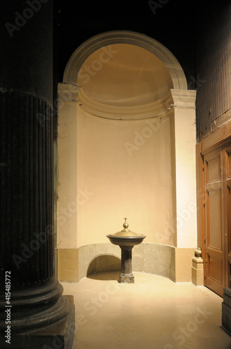 Baptismal urn under an arched dome, Eglise Saint Pothin, Lyon, France photo