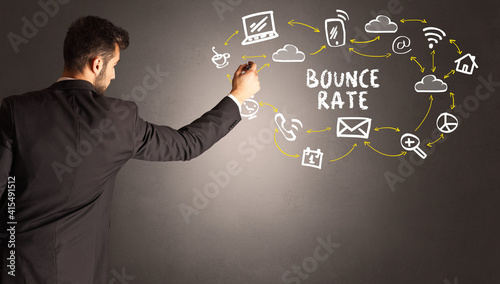 businessman drawing social media icons with BOUNCE RATE inscription, new media concept