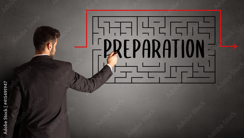 businessman drawing maze with PREPARATION inscription, business education concept businessman drawing maze with PREPARATION inscription, business education concept