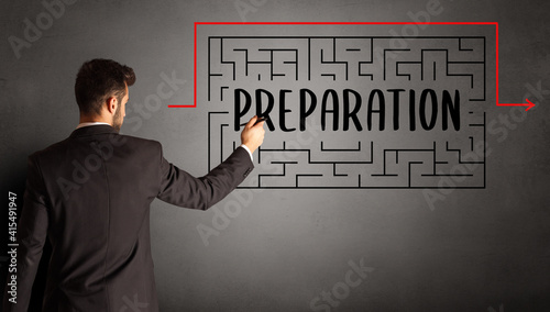 businessman drawing maze with PREPARATION inscription, business education concept