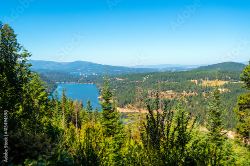 View of Fernan Lake and Lake Coeur d'Alene including the downtown skyline in the mountains of Coeur d'Alene, Idaho USA