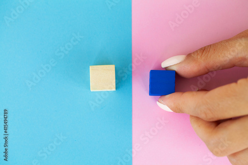 Hand putting and stacking blank wooden cubes on table with copy space for input wording and infographic icon.