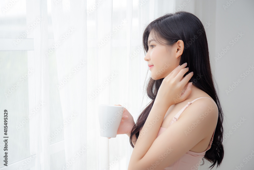 Beautiful young asian sexy woman in underwear drinking coffee near windows in the morning, girl with seductive figure fit drinking beverage for relax and resting after wake up, lifestyle concept. Beautiful young asian sexy woman in underwear drinking coffee near windows in the morning, girl with seductive figure fit drinking beverage for relax and resting after wake up, lifestyle concept.