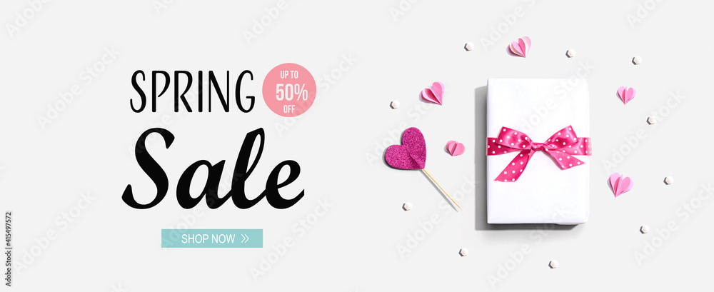 Fototapeta premium Spring sale message with a gift box and paper hearts