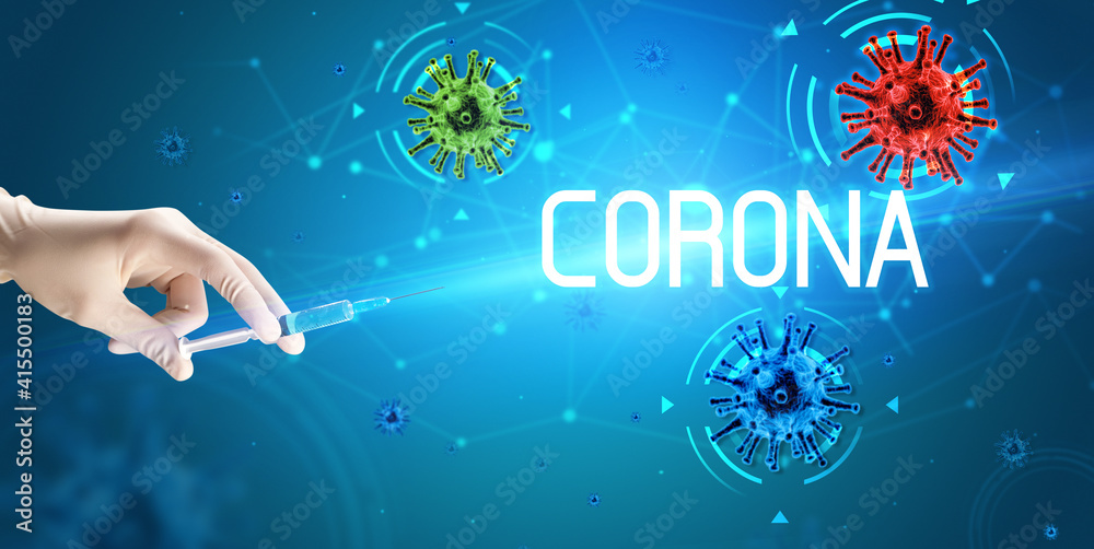 Syringe, medical injection in hand with CORONA inscription, coronavirus vaccine concept