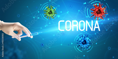 Syringe  medical injection in hand with CORONA inscription  coronavirus vaccine concept