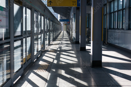 subway station under sunshine. Perspective platform background.