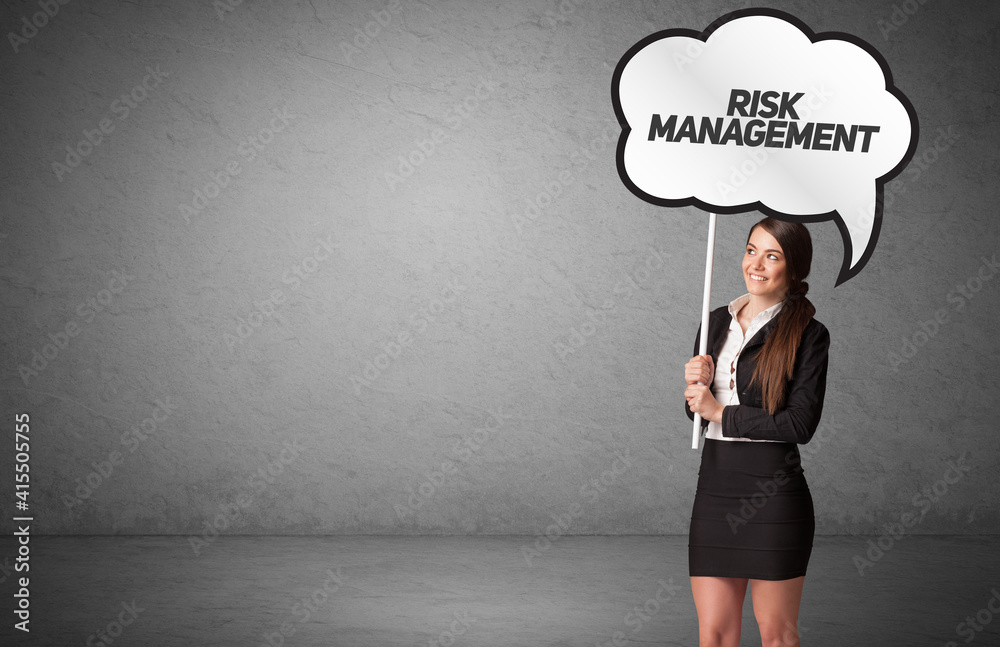 Young business person in casual holding road sign with RISK MANAGEMENT inscription, new business idea concept Young business person in casual holding road sign with RISK MANAGEMENT inscription, new business idea concept