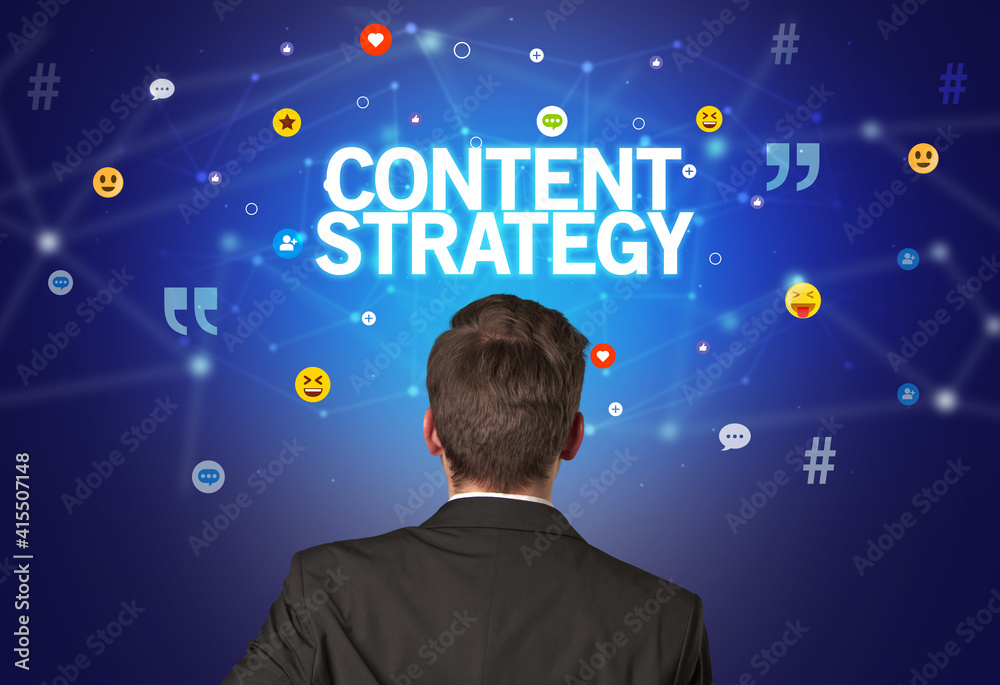 Rear view of a businessman with CONTENT STRATEGY inscription, social networking concept Rear view of a businessman with CONTENT STRATEGY inscription, social networking concept